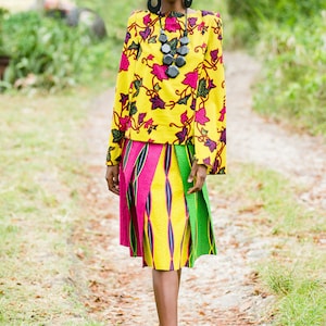 GRIZEL CAPE TOP  Made in African wax print, this floral print top&#39;s cape overlay sways with each step