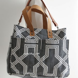 May include: A gray and white geometric patterned tote bag with brown leather straps and metal accents. The bag has a large pocket on the front and the text "ithinksew.com" is printed on the front.