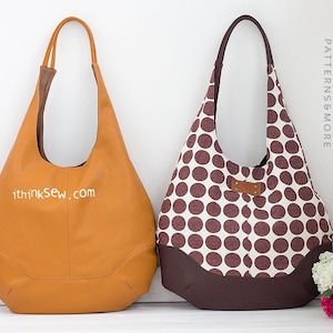 May include: Two tote bags, one brown leather and one white with brown polka dots. Both bags have brown leather trim and a brown leather strap.