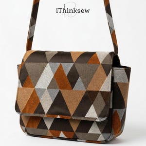 May include: A geometric patterned crossbody bag in shades of brown, tan, and gray. The bag features a flap closure and a side pocket. The strap and the bag's body have the same geometric pattern. The text "iThinksew" is visible on the top of the bag.