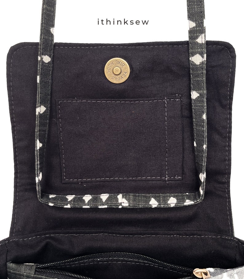 May include: Black fabric purse with a white diamond pattern on the strap and trim. The interior features a pocket and a magnetic snap closure. The text "ithinksew" is visible in the upper right corner.