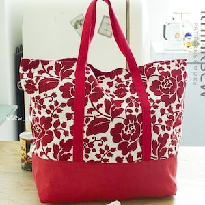 May include: A red and white floral tote bag with red handles. The bag has a solid red bottom and the text "ithinksew.com" is printed on the side.