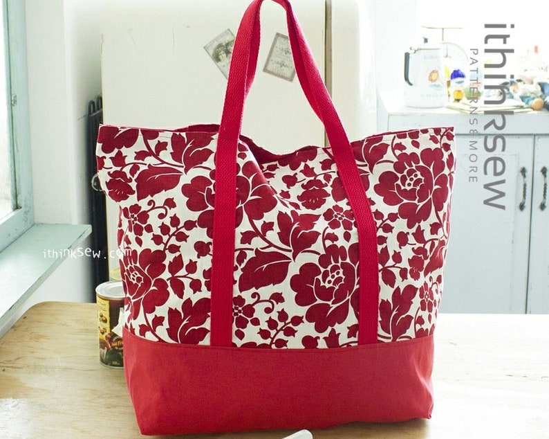 May include: A red and white floral tote bag with red handles. The bag has a solid red bottom and the text "ithinksew.com" is printed on the side.