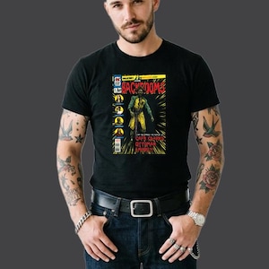May include: A black short-sleeved t-shirt featuring a graphic print of a comic book cover titled Backrooms. The design includes a central figure in a yellow and green outfit, yellow radiating lines, and the text Can You Handle The Horror Of Capn Clarks Ottoman Empire?