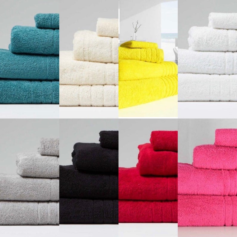 May include: Six stacks of towels in different colors, including teal, white, yellow, gray, black, and pink. Each stack has four towels of varying sizes.