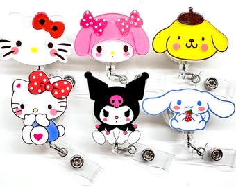 May include: Set of six colorful cartoon character badge holders. The characters include Hello Kitty, My Melody, Kuromi, Cinnamoroll, and Pompompurin. Each badge holder features a different character with a unique design and color scheme.
