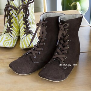 May include: Two pairs of lace-up boots. One pair is brown and the other pair is green and white with a zebra print. The brown boots have the text "ithinksew.com" on the side.