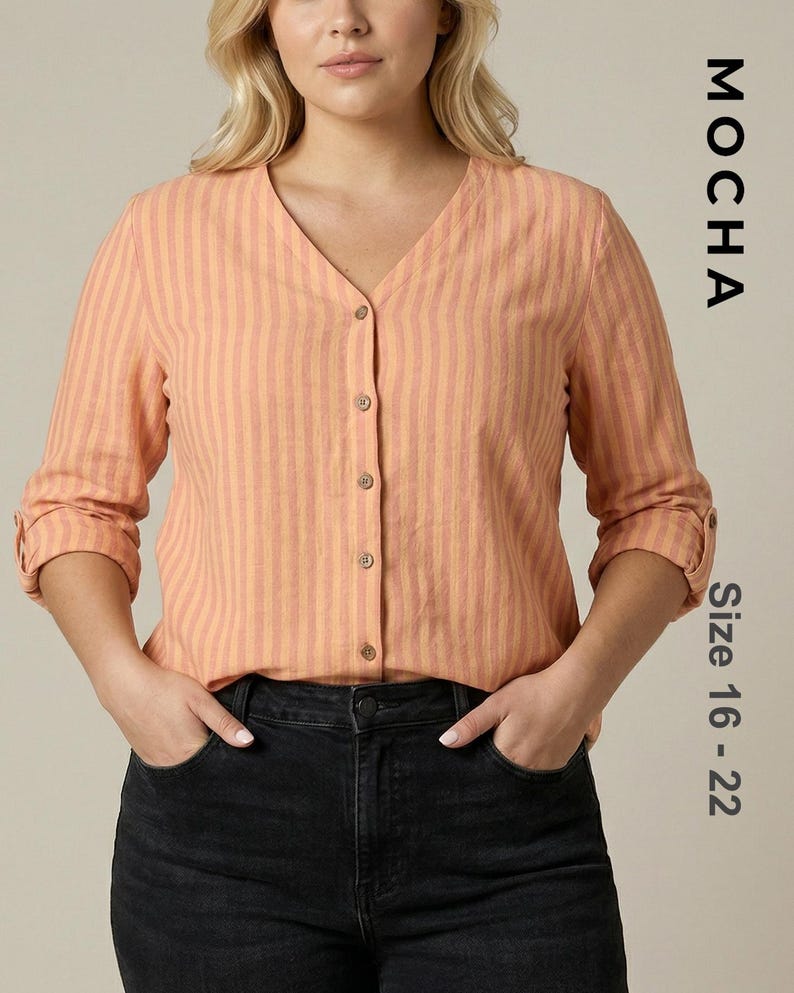 Plus-size model wearing a peach and orange striped V-neck button-down blouse with rolled sleeves. Represents a curvy fit PDF sewing pattern for women sizes 16 to 22 with long and folded sleeve options.