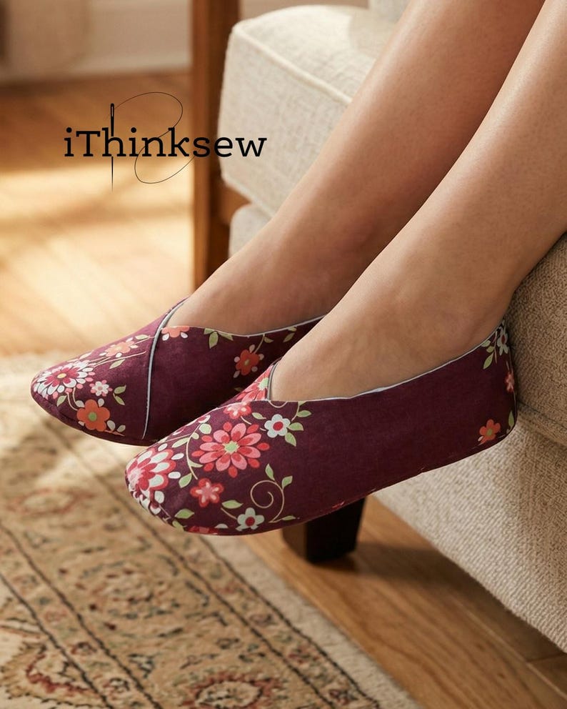 May include: Burgundy floral print slippers with a white trim. The slippers feature a repeating pattern of pink and orange flowers and green leaves. The text "iThinksew" is in the upper left corner.