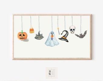 Puede incluir: Una ilustración de acuarela de decoraciones de Halloween colgando de una cuerda. Las decoraciones incluyen una calabaza, maíz dulce, un gato negro, un fantasma, un sombrero de bruja, una calavera y un murciélago.