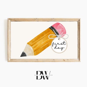 May include: A watercolour illustration of a yellow pencil with a pink eraser and a black tip. A small tag with the words "first day" is tied to the pencil with white string. The image is framed in a light wood frame.