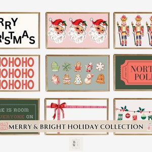 May include: A selection of framed Christmas art prints. The prints display festive designs such as Santa Claus, nutcrackers, gingerbread biscuits, and the text "Merry Christmas" and "North Pole". The collection is labelled "Merry & Bright Holiday Collection".