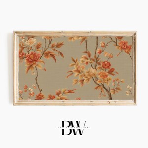 May include: A framed print of a floral pattern with orange and yellow flowers on a beige background.