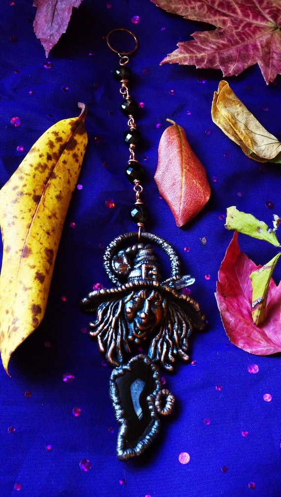 Electroformed copper gothic wall piece embedding real black agate and confetti sunstone — alchemical-looking metalwork that looks like it came from a Victorian cabinet of curiosities.