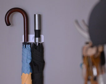 Soporte minimalista para paraguas