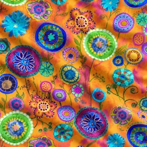 May include: A fabric featuring a vibrant orange background with a repeating pattern of stylized flowers in shades of blue, purple, green, and yellow. The floral motifs include circular shapes, petals, and thin stems, creating a dense, colorful design.