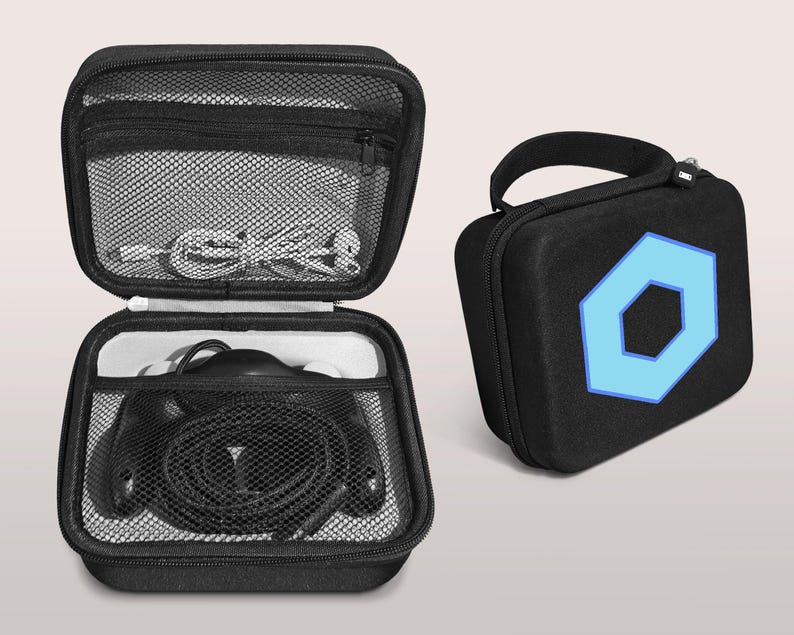 May include: Black zippered carrying case with a blue geometric design. The case is open, revealing headphones and a mesh pocket with cables. A second closed case with a handle and the same blue design is also shown.