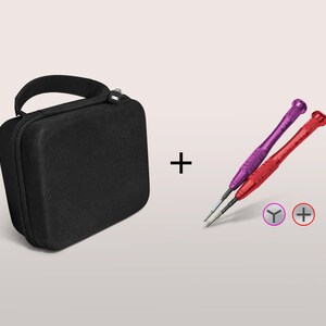 May include: Black zippered carrying case with a handle, plus two precision screwdrivers, one purple and one red. The screwdrivers have different tip styles, indicated by the symbols next to them.