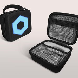 May include: Black, square, zippered carrying case with a light blue hexagon design. The case has a handle and a mesh interior. One case is open, revealing the interior mesh and a small compartment.