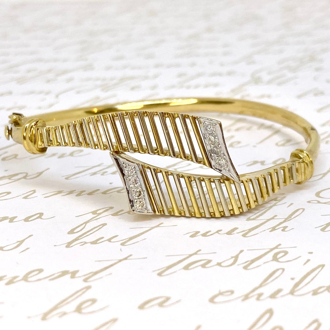 A 14 carat gold diamond loop bangle-SOLD OUT
