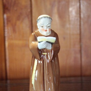 Apagavelas vintage con figura de monje real de Worcester