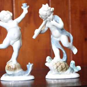 2 Vintage METZLER ORTLOFF German Porcelain Cherub Spring & Winter Figurines