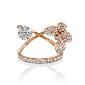 May include: A rose gold ring with a delicate butterfly design set with sparkling diamonds. The ring features a cluster of diamonds on one side and a butterfly design with two wings on the other side.