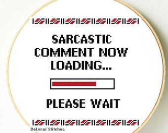 May include: White embroidery hoop with black text that reads "Sarcastic Comment Now Loading..." with a red progress bar and the text "Please Wait" below. The hoop has a red and black border.