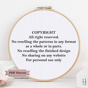 May include: A white embroidery hoop with black text that reads "COPYRIGHT All right reserved. No reselling the patterns in any format as a whole or in parts. No reselling the finished design No sharing on any website For personal use only PDF Pattern DeLorai Patterns"