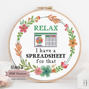 May include: A cross-stitch pattern with a floral wreath surrounding the text "RELAX I have a SPREADSHEET for that". The pattern also includes a spreadsheet icon. The pattern is labeled with the number "#895" and "PDF Pattern".
