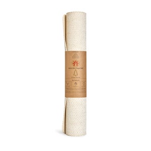 May include: Rolled up natural beige yoga mat made from tree rubber. The mat is 4mm thick and has a label that says "4mm Eco Yoga Mat" and "My Planet".