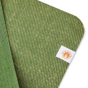 May include: Green yoga mat with a woven texture and a white label with the text "Complete Unity Yoga" and a stylized orange flower design.
