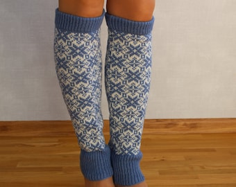 May include: A pair of blue and white patterned leg warmers. The leg warmers have a geometric design and are made of a soft, knitted fabric.
