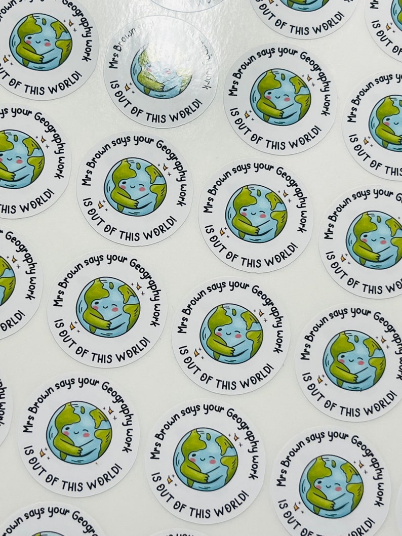 May include: A set of round stickers with a cartoon illustration of a smiling earth hugging itself. The text on the stickers reads "Mrs. Brown says your Geography work is out of this world!"