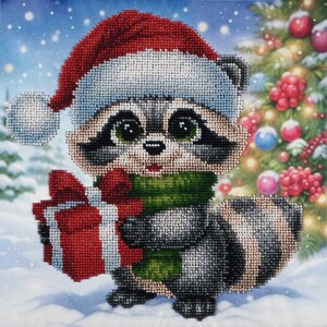 May include: A cute raccoon wearing a red Santa hat and a green scarf holds a red and white wrapped gift in front of a snowy winter scene with a decorated Christmas tree in the background.