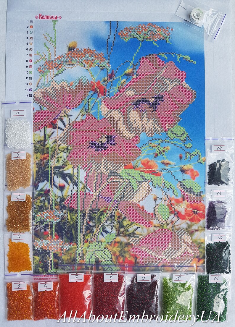 May include: A close-up of a diamond painting kit with a colorful floral design featuring red poppies. The kit includes a canvas, beads, and instructions. The beads are organized in small plastic bags labeled with numbers.