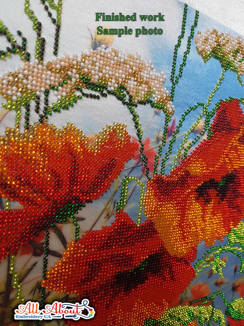 May include: Close-up of a beaded embroidery design featuring red poppies with green stems and leaves. The background is a light blue fabric with white flowers.