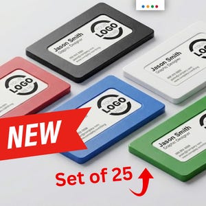 May include: A set of 25 business card holders in various colors: black, white, red, blue, and green. Each holder features a white card with the text "Jason Smith, Graphic Designer" and a logo. A red banner reads "NEW".