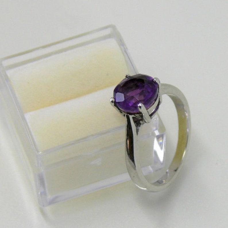 Slim Beauty Design ring in your size for gem purchased from us. Ring silver rhodium plt. Custom cast, 8 mm size gem only RingSSP11