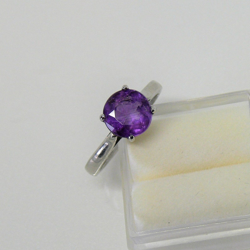 Slim Beauty Design ring in your size for gem purchased from us. Ring silver rhodium plt. Custom cast, 8 mm size gem only RingSSP11