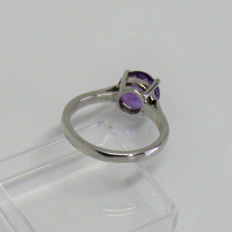 Slim Beauty Design ring in your size for gem purchased from us. Ring silver rhodium plt. Custom cast, 8 mm size gem only RingSSP11