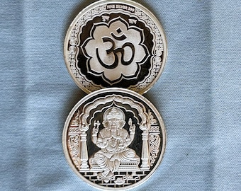 OM Ganesh Coin: 10 g, 99.9 Silver, OM on one side and Ganesh on other side. Excellent finish & detailed workmanship (USA). Collector's item.