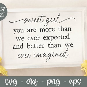 May include: White sign with black text that reads "sweet girl you are more than we ever expected and better than we ever imagined".