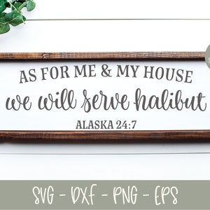 May include: A wooden sign with the text "AS FOR ME & MY HOUSE we will serve halibut ALASKA 24:7" in a cursive font. The sign is framed in a dark wood frame.