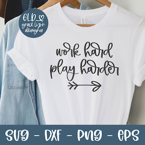 May include: White t-shirt with black text that reads "work hard play harder" with a small arrow underneath.