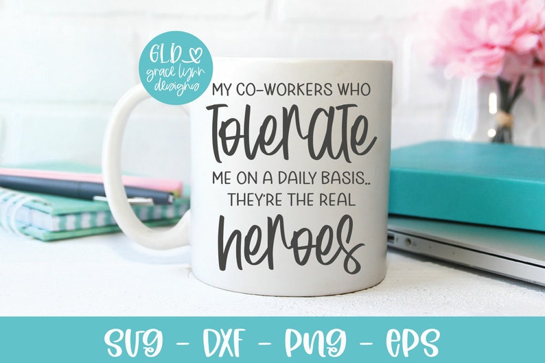 May include: White ceramic mug with black text that reads "My co-workers who tolerate me on a daily basis... They're the real heroes".