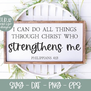 May include: A white sign with a wood frame, featuring the text "I can do all things through Christ who strengthens me" with the scripture reference "Philippians 4:13".