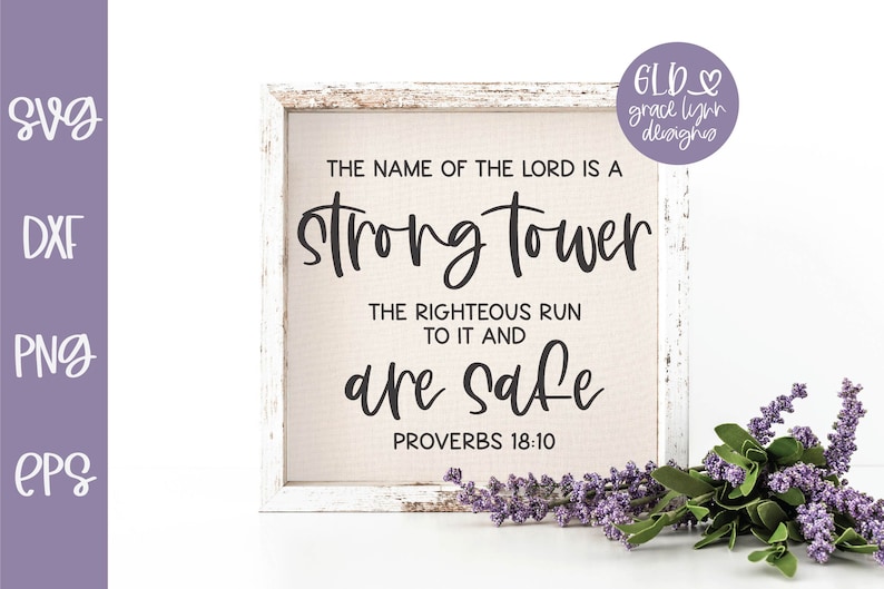 May include: A white wooden frame with a beige canvas insert. The canvas has black text that reads "The name of the Lord is a strong tower. The righteous run to it and are safe. Proverbs 18:10".
