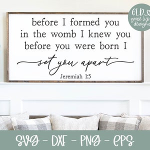 May include: A white sign with a wood frame and the text "before I formed you in the womb I knew you before you were born I set you apart Jeremiah 1:5" in black lettering.