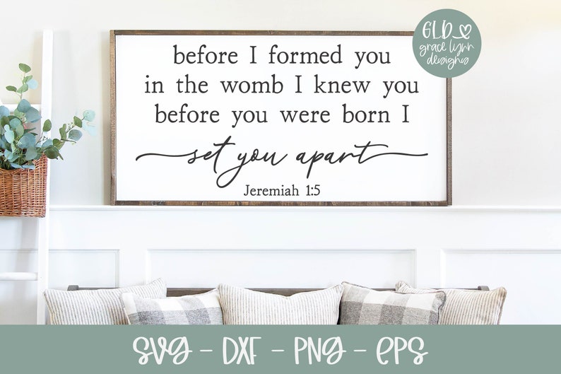 May include: A white sign with a wood frame and the text "before I formed you in the womb I knew you before you were born I set you apart Jeremiah 1:5" in black lettering.